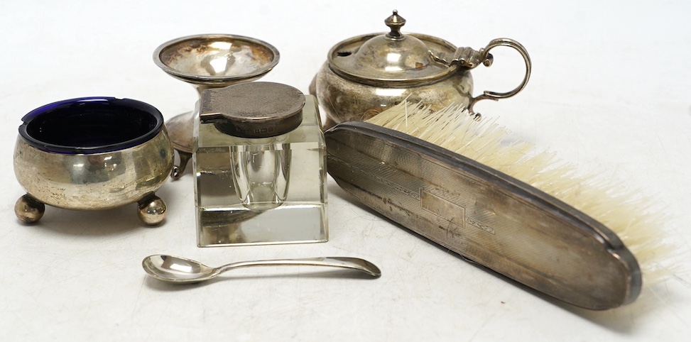 A George V silver miniature font, inscribed 'The Tin Plate Worker's Company', Lee & Wigful, Sheffield, 1924, 45mm, together with seven assorted silver condiments including George III silver mustard by Henry Chawner, a si